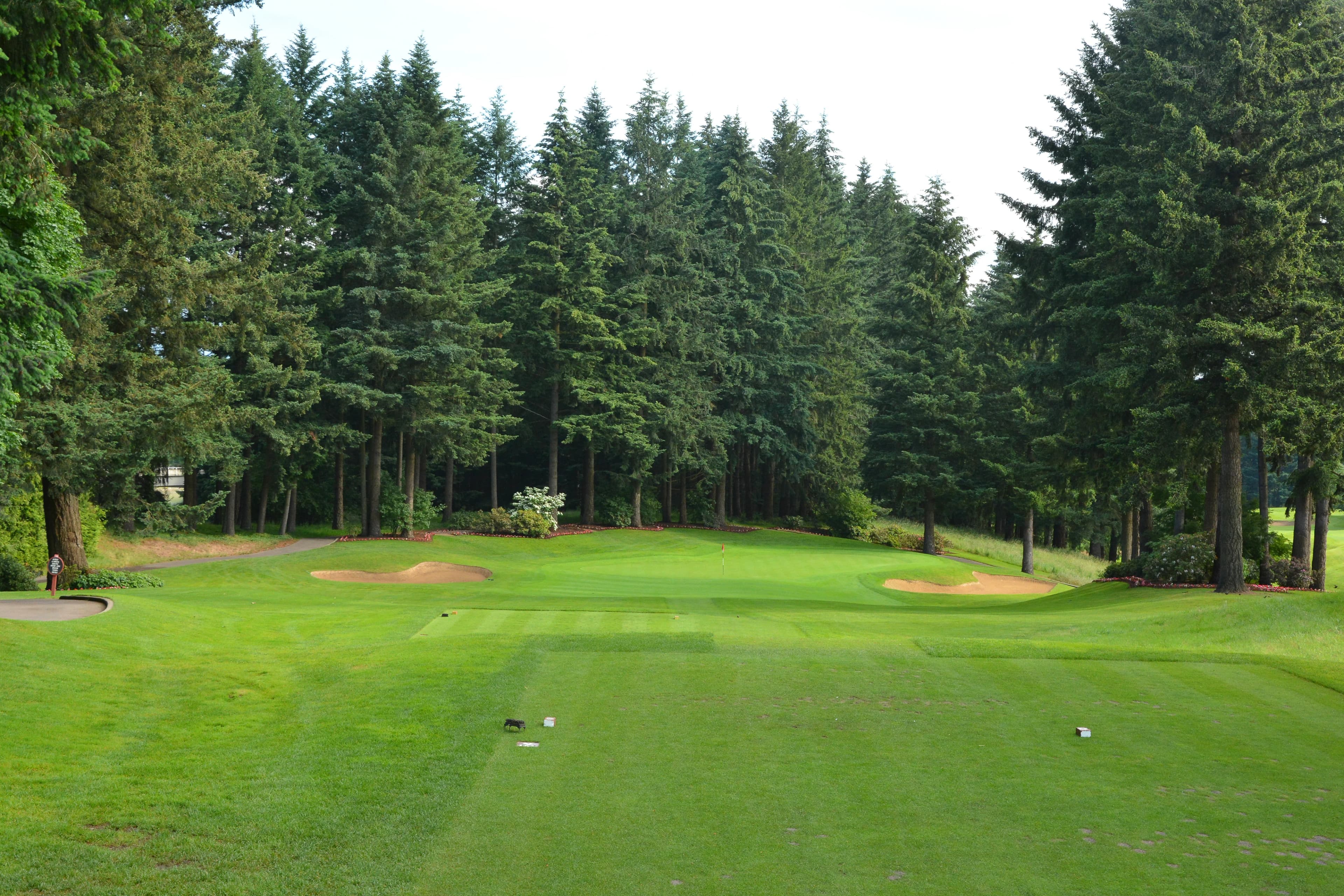 Langdon Farms Golf Club in Aurora, Oregon — resort, 18-hole golf course, designed by Langdon Farms Golf Club's state-of-the-art practice area boasts the largest grass teeing surface in the Northwest. The practice range consists of 28 covered and lighted teaching stalls. Additional amenities include a golf shop, full service restaurant, drive-thru snack bar, and the "Red Shed" event facility which can accommodate groups of up to 350 people. The charming Langdon Farms clubhouse is designed to blend in with the farming community.
